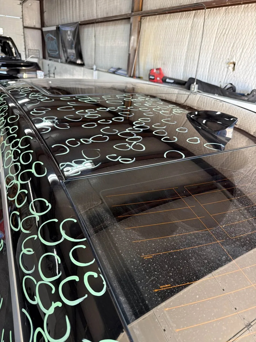 Hail damage on a car roof marked for paintless dent repair at Turner PDR in Lubbock